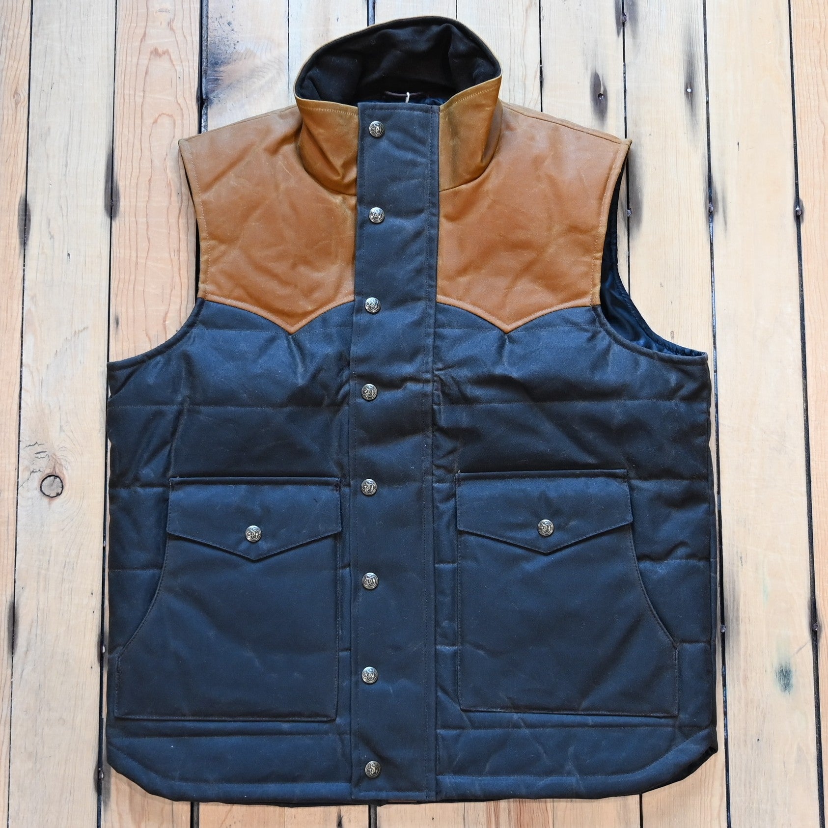 Schaefer Outfitter RangeWax Puffer Vest in waxed cotton canvas with high collar, wool insulation and front utility pockets