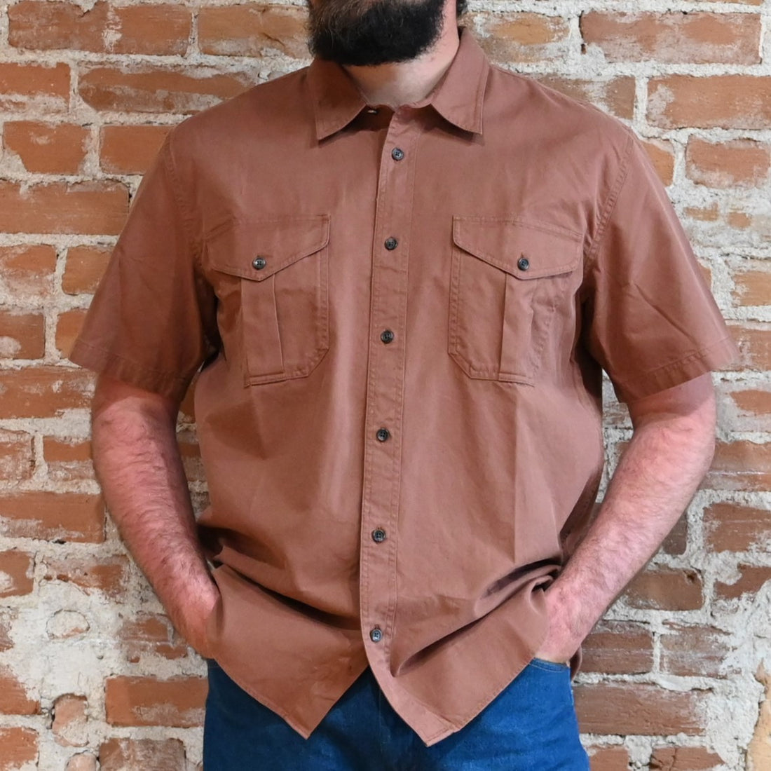 View of Filson Alaskan Guide Shirt featuring lightweight cotton twill fabric, short sleeves, and gusseted chest pockets