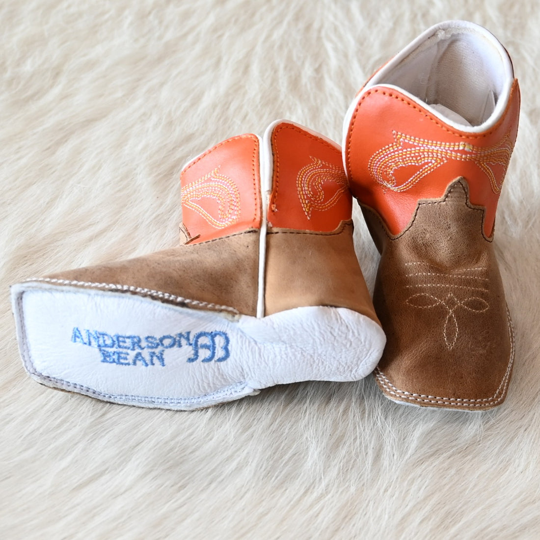 View of Anderson Bean Baby Bean boot with tan Crazy Horse vamp, tangerine top, and soft sole