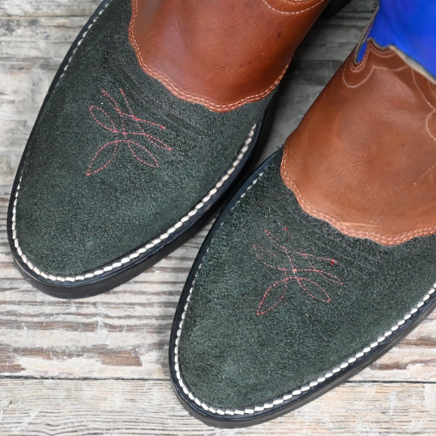 View of Hondo 16" cowboy boot with royal blue top, black roughout vamp, brown overlay, and pull holes