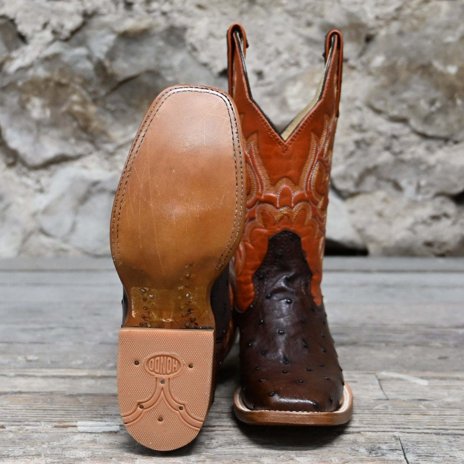 View of Hondo 11" cowboy boot with orange volcano top, brown full quill ostrich vamp, and medium square toe