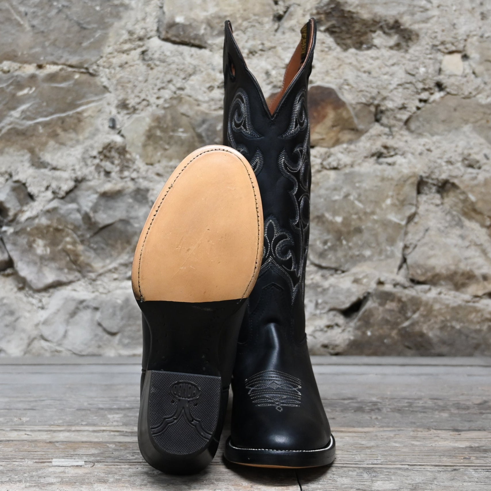 View of Hondo 16" cowboy boot in black retan with flourished stitching, pull holes, and spur ledge