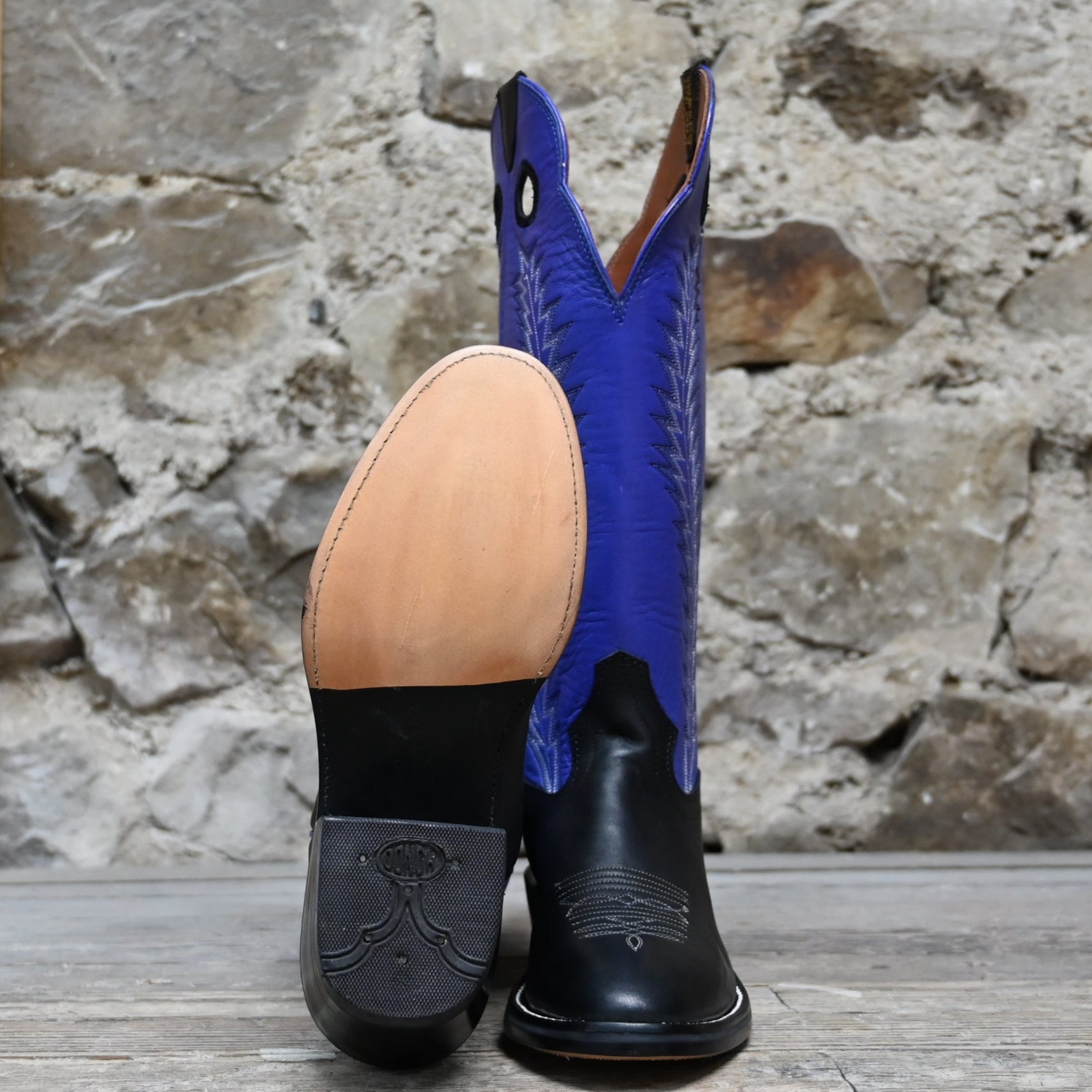 View of Hondo 16" cowboy boot with purple top, black retan vamp, pull holes, and spur ledge