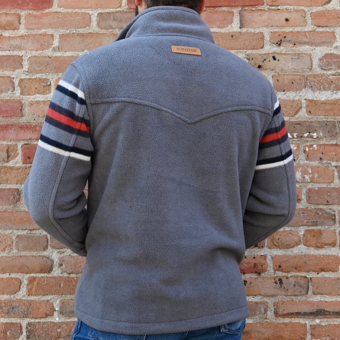 View of Schaefer Teton pullover fleece in Teton or Silverton color with storm collar and zip waist pockets