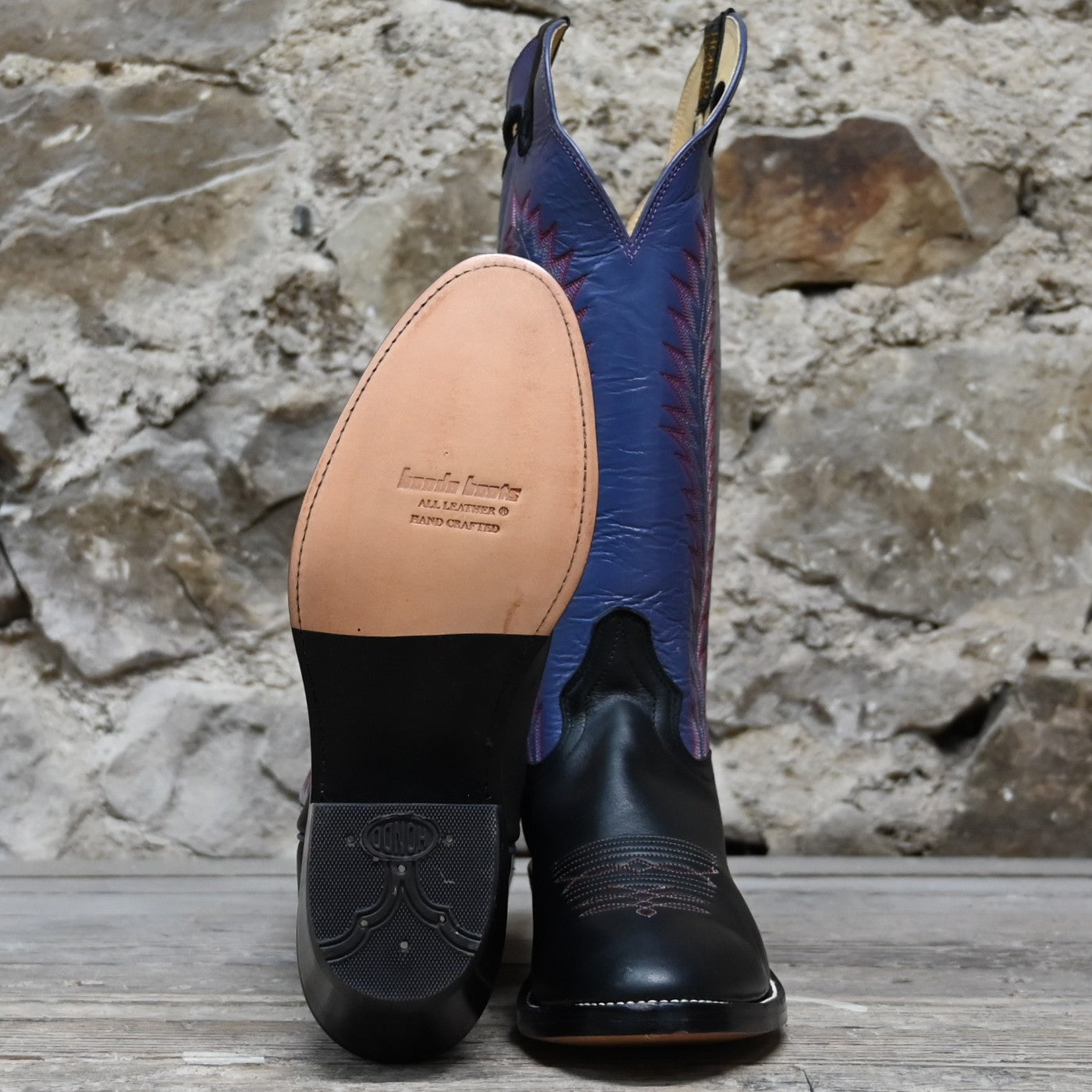 View of Hondo 16" cowboy boot with purple top, black retan vamp, pull holes, and medium round toe