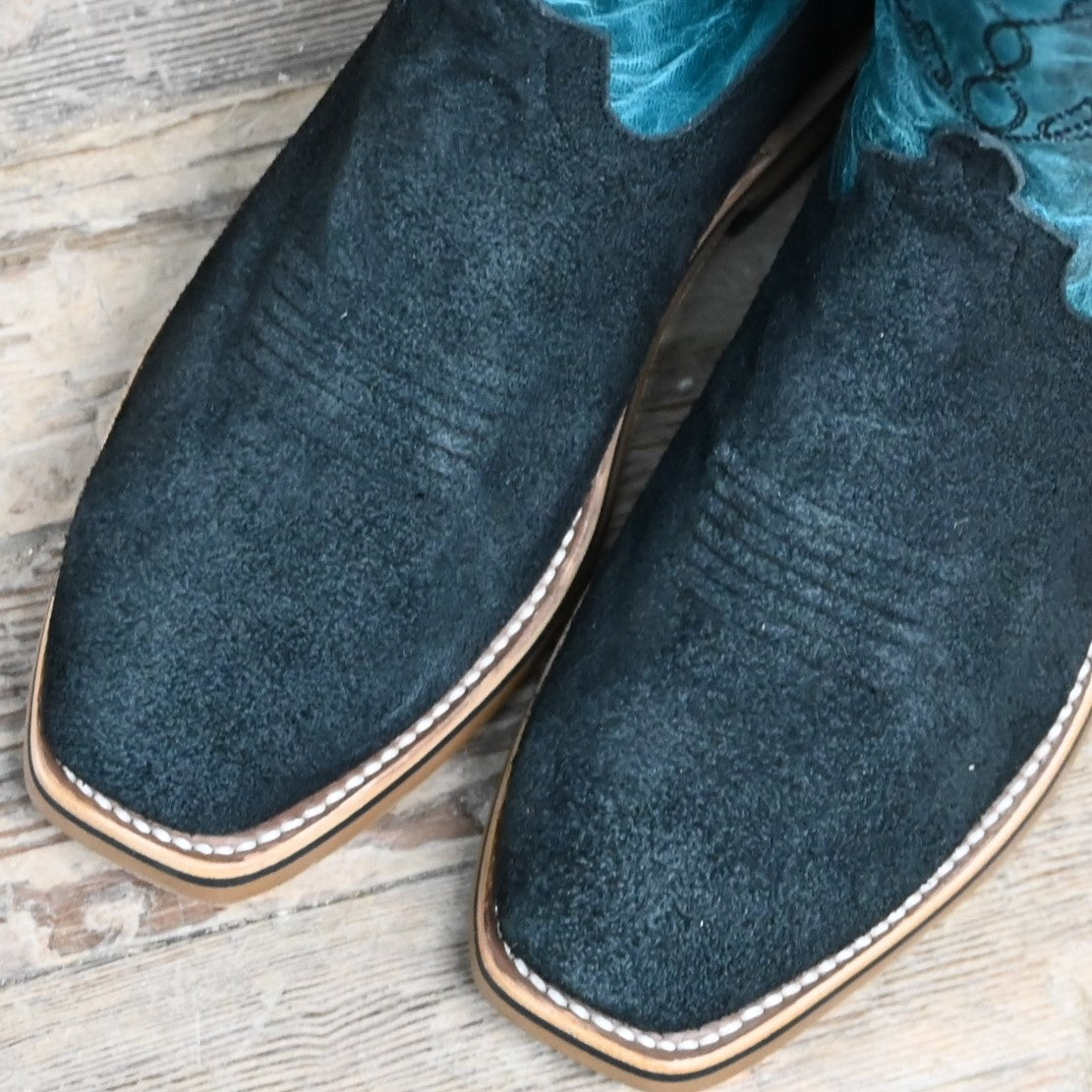 View of Horse Power 11" boot with black suede vamp, blue volcano shank and top, cutter toe, and pull holes