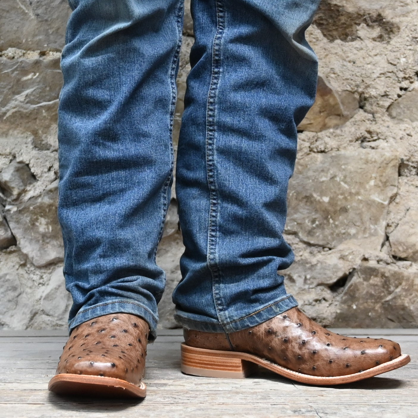 View of Hyer JETMORE 13" boots showcasing tabac full-quill waxy ostrich vamp and blue vintage goat upper with broad square toe and Stockman block heel