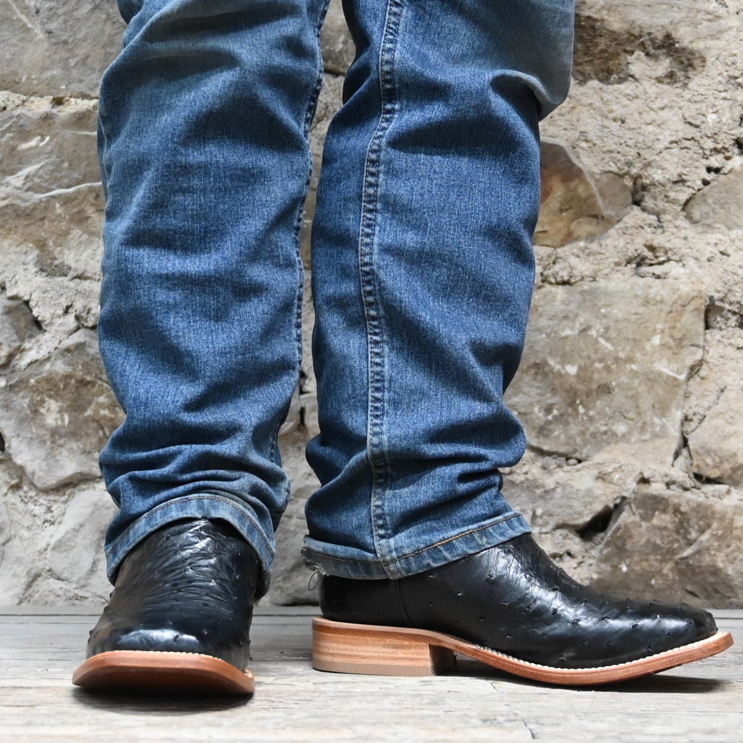 View of Hyer JETMORE 13" boots showcasing black full-quill ostrich vamp and red vintage goat upper with broad square toe and Stockman block heel