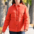 View of Filson Ladies Waxed Down Barn Coat in Campfire featuring antique-finish brass snaps and microfleece-lined hand pockets