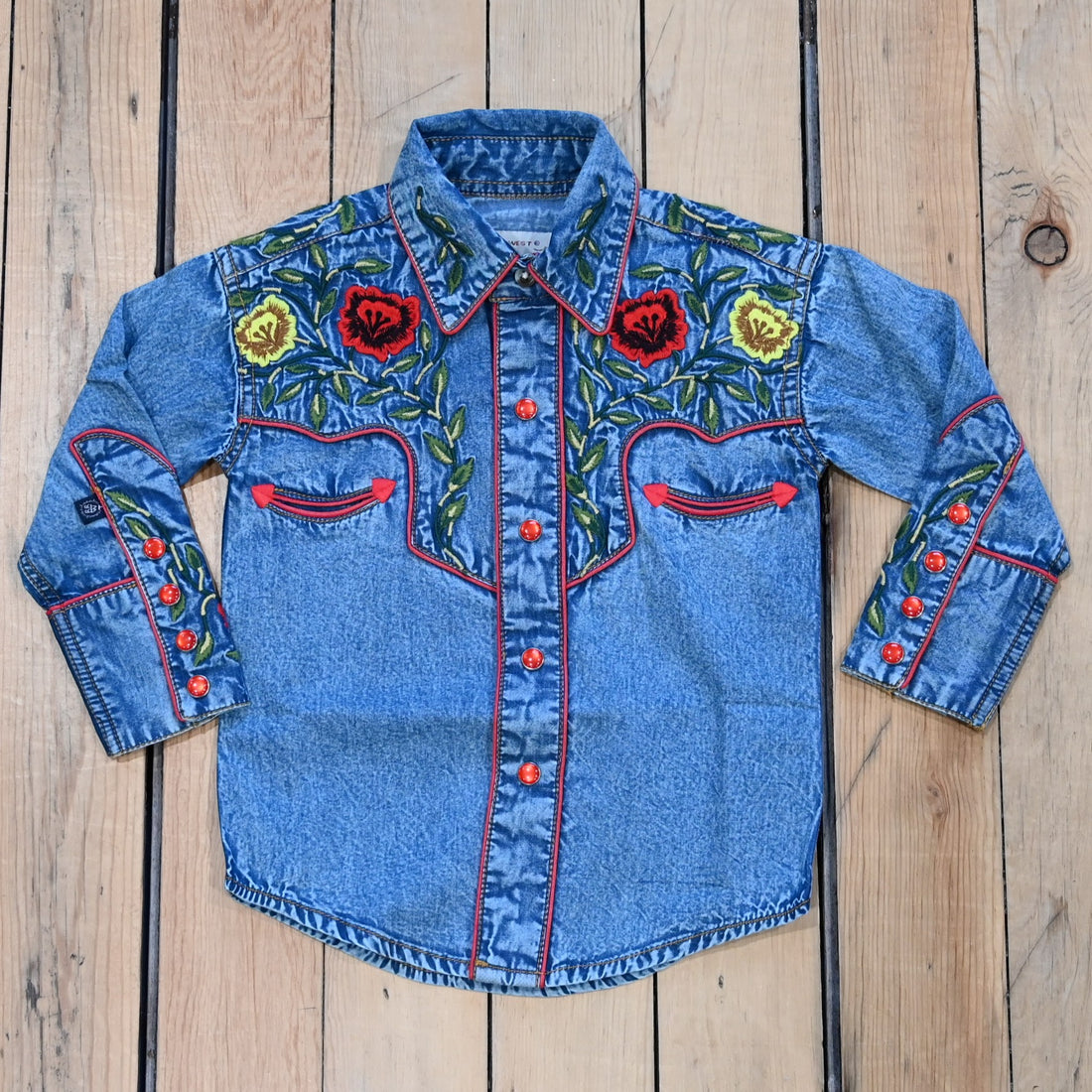 View of Rockmount kids denim shirt with red and yellow floral embroidery and western details