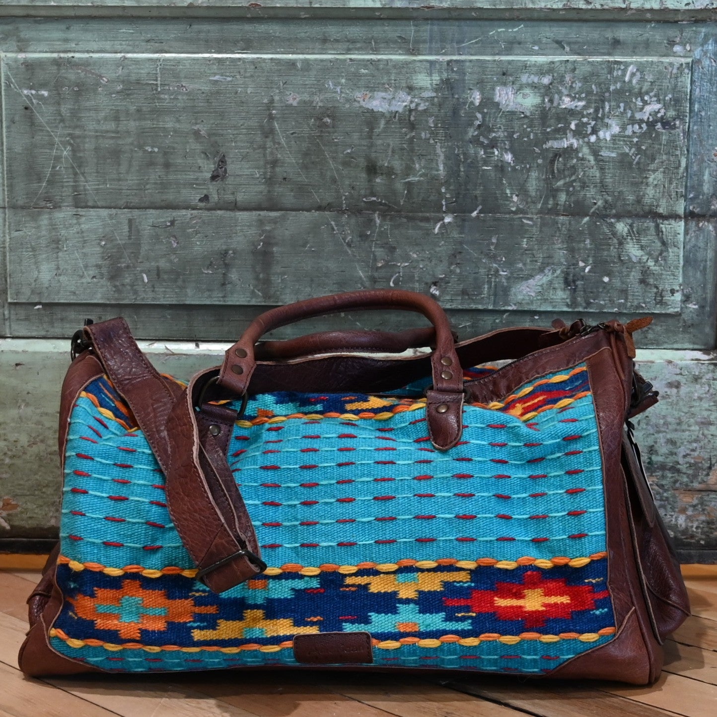 American Darling Blue Saddle Blanket Duffel Bag with genuine leather trim and multicolor Southwestern pattern