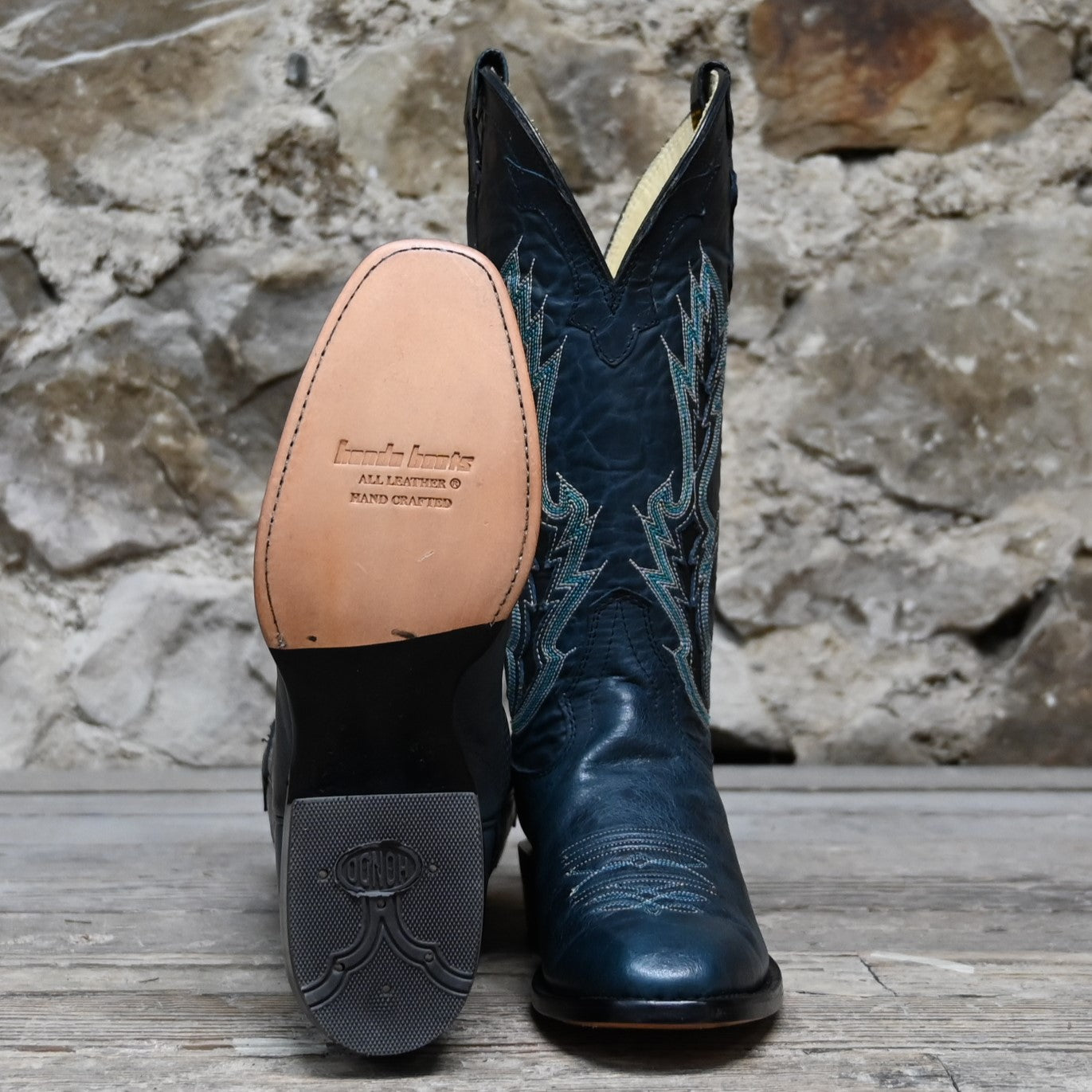 View of Hondo 13" cowboy boot in blue cowhide with tight French square toe and spur ledge
