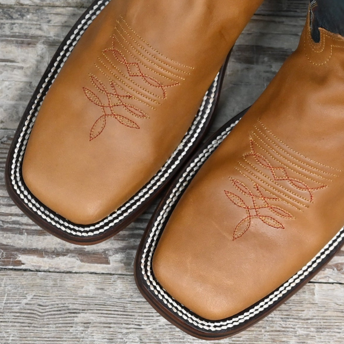 View of Hondo 16" cowboy boot with navy volcano top, honey crazy horse vamp, wide square toe, and pull holes