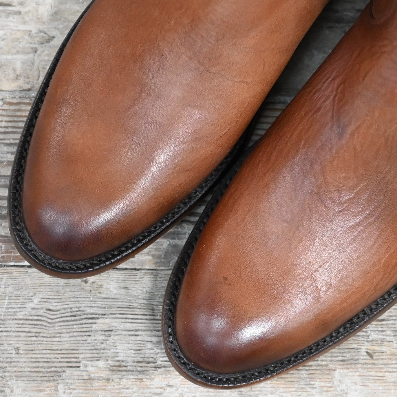 Lucchese Men’s dark brown calf leather western boot with roper toe and American craftsmanship.