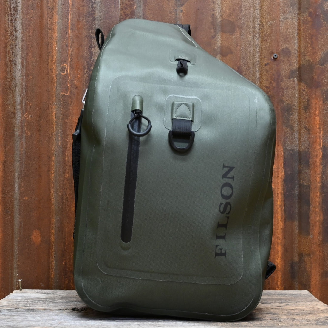View of Filson Dry Sling Pack in Green featuring waterproof construction and ergonomic design