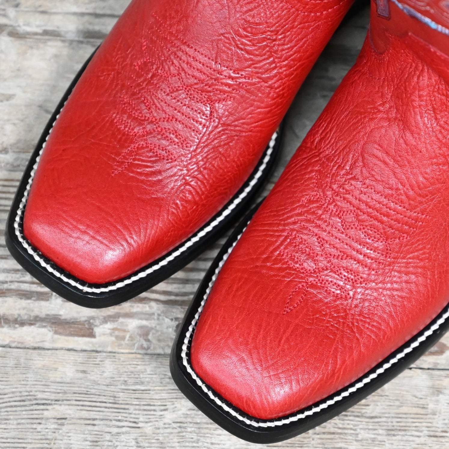 View of Hondo 13" cowboy boot with red cowhide top, red shoulder vamp, and medium square toe