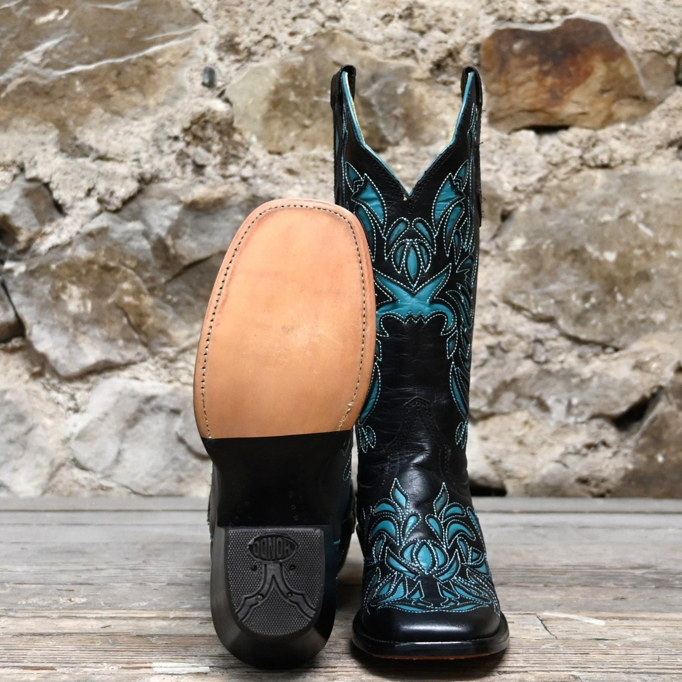 View of Hondo 13" black volcano cowboy boot with turquoise inlays and wide square toe