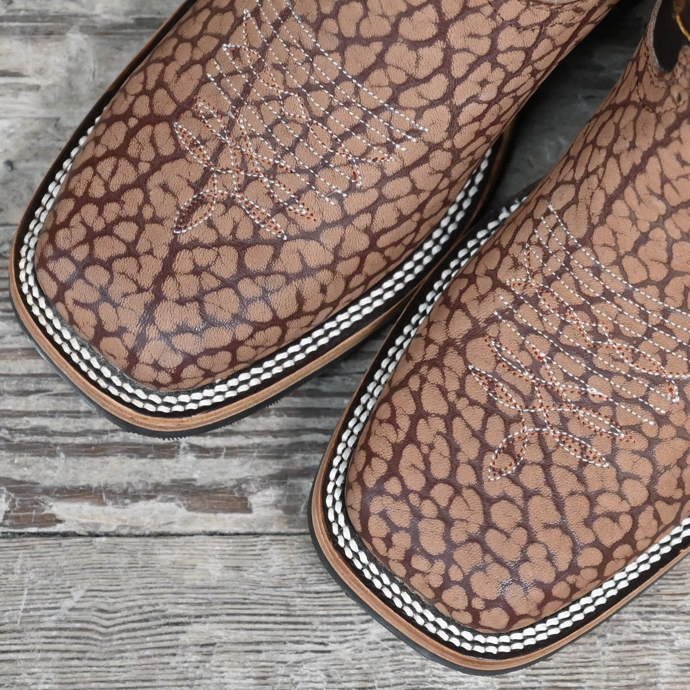 View of Hondo 11" cowboy boot with sand nubuck bullhide vamp, brown volcano top, and wide square toe