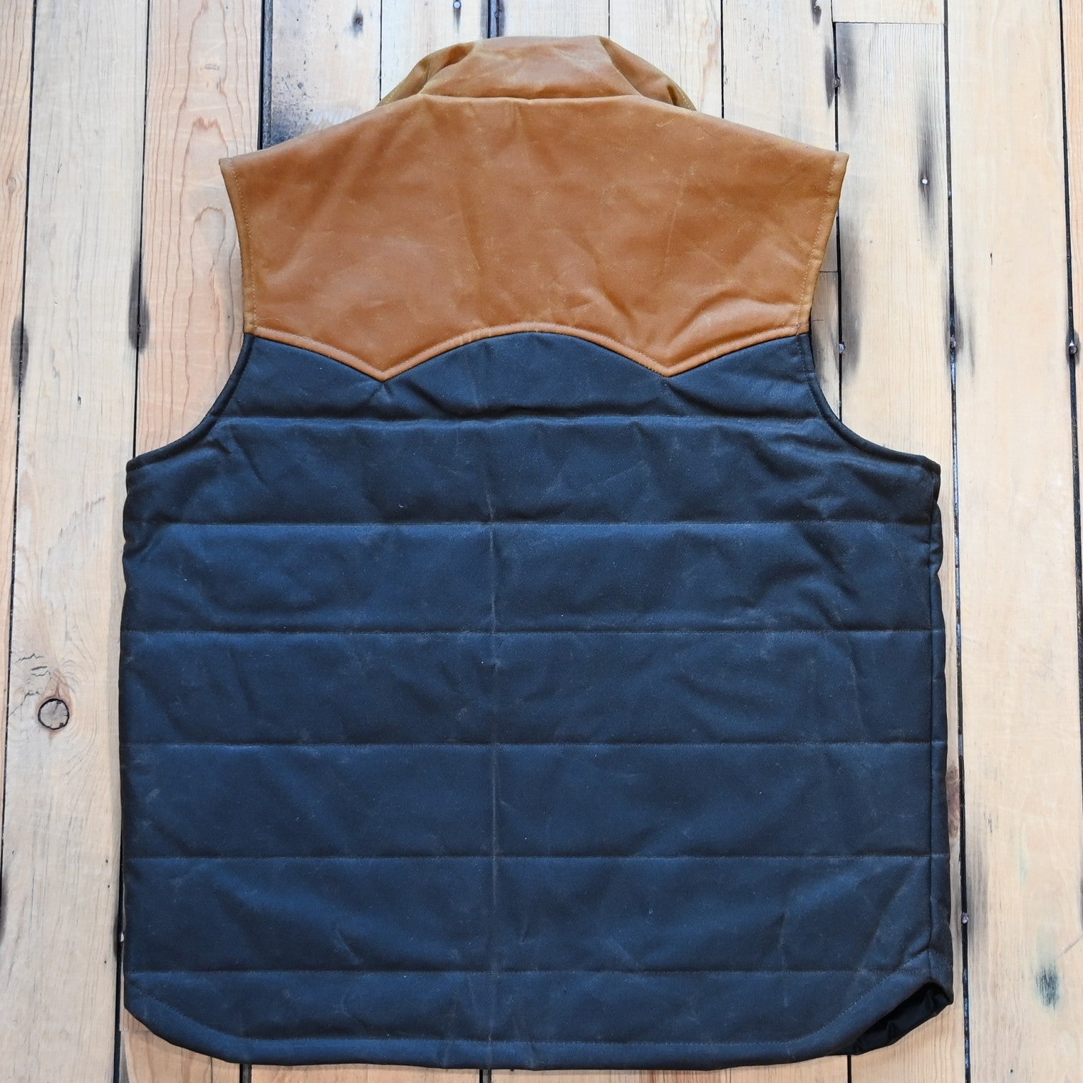 Schaefer Outfitter RangeWax Puffer Vest in waxed cotton canvas with high collar, wool insulation and front utility pockets