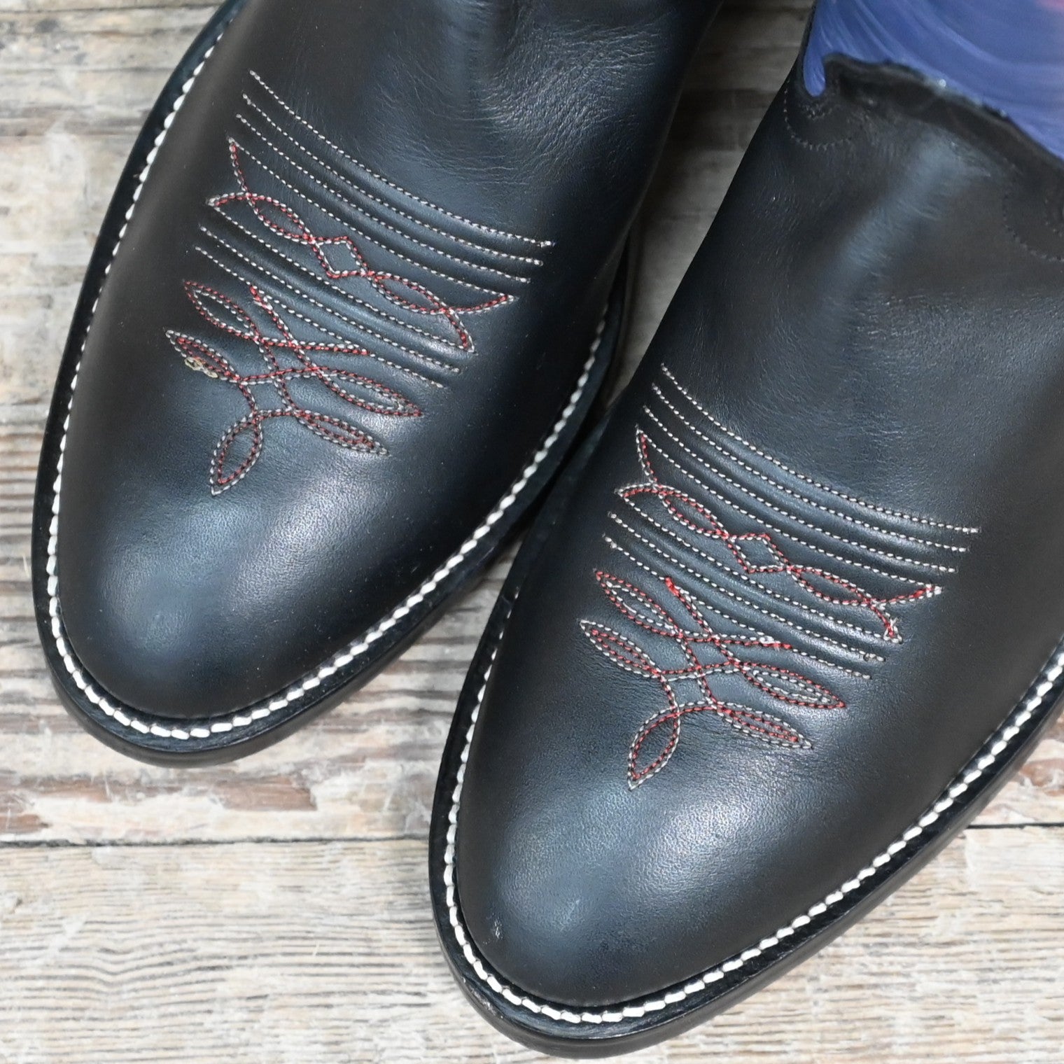 View of Hondo 16" cowboy boot with purple top, black retan vamp, pull holes, and medium round toe