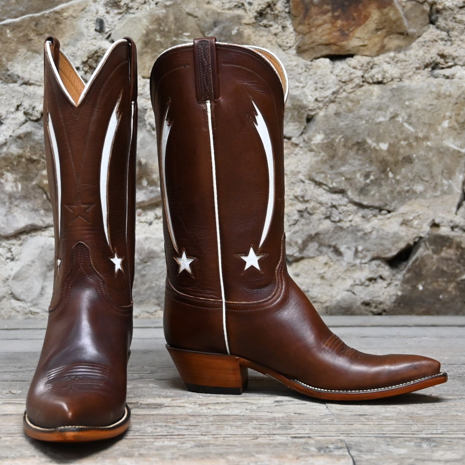 View of Lucchese ladies 12″ honey leather boot with star inlay and pointed square toe