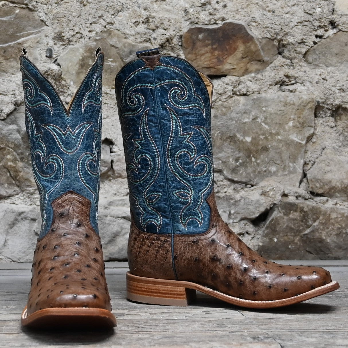 View of Hyer JETMORE 13" boots showcasing tabac full-quill waxy ostrich vamp and blue vintage goat upper with broad square toe and Stockman block heel