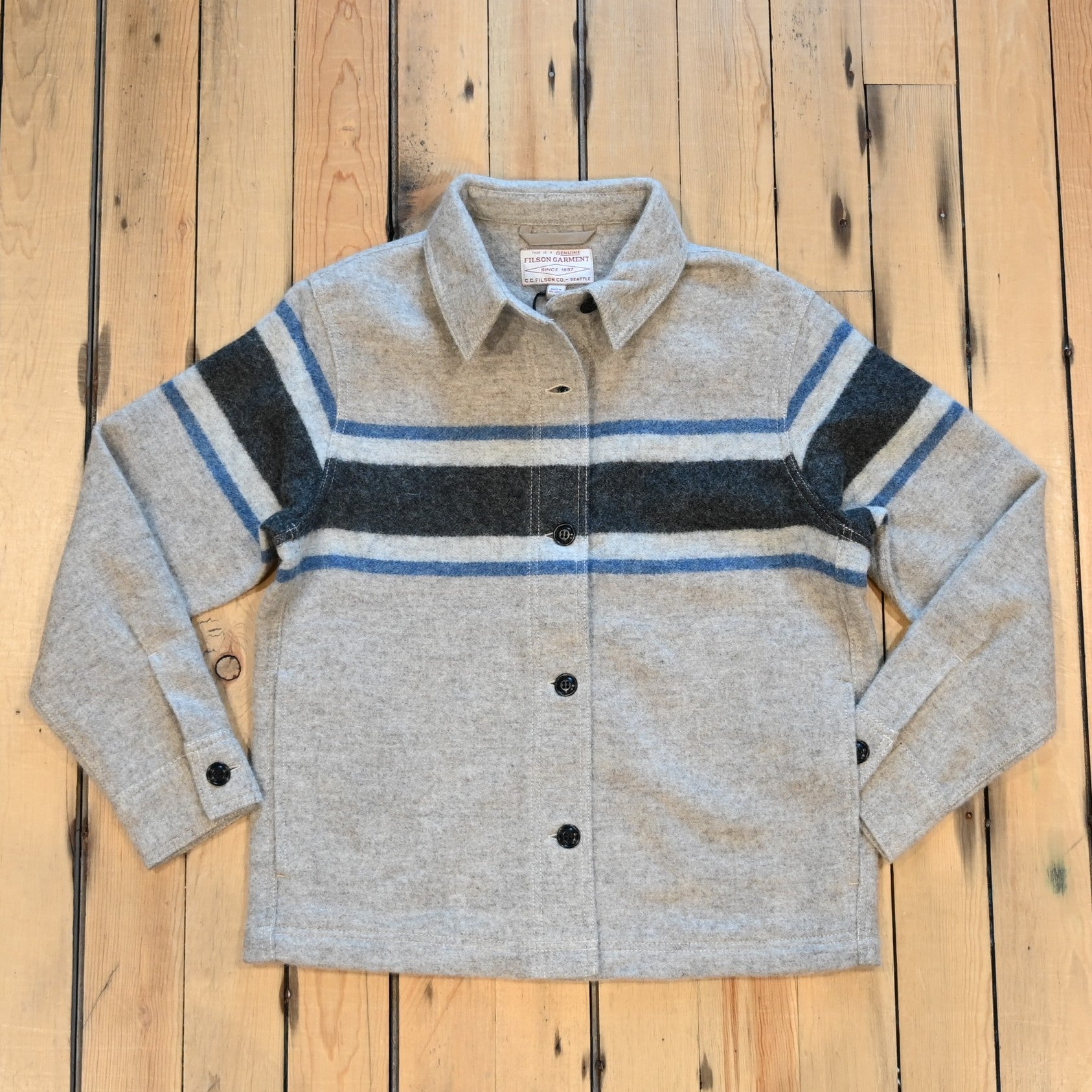 Filson Ladies Wool Overshirt in gray with black blanket stripes, chest pockets, and button front