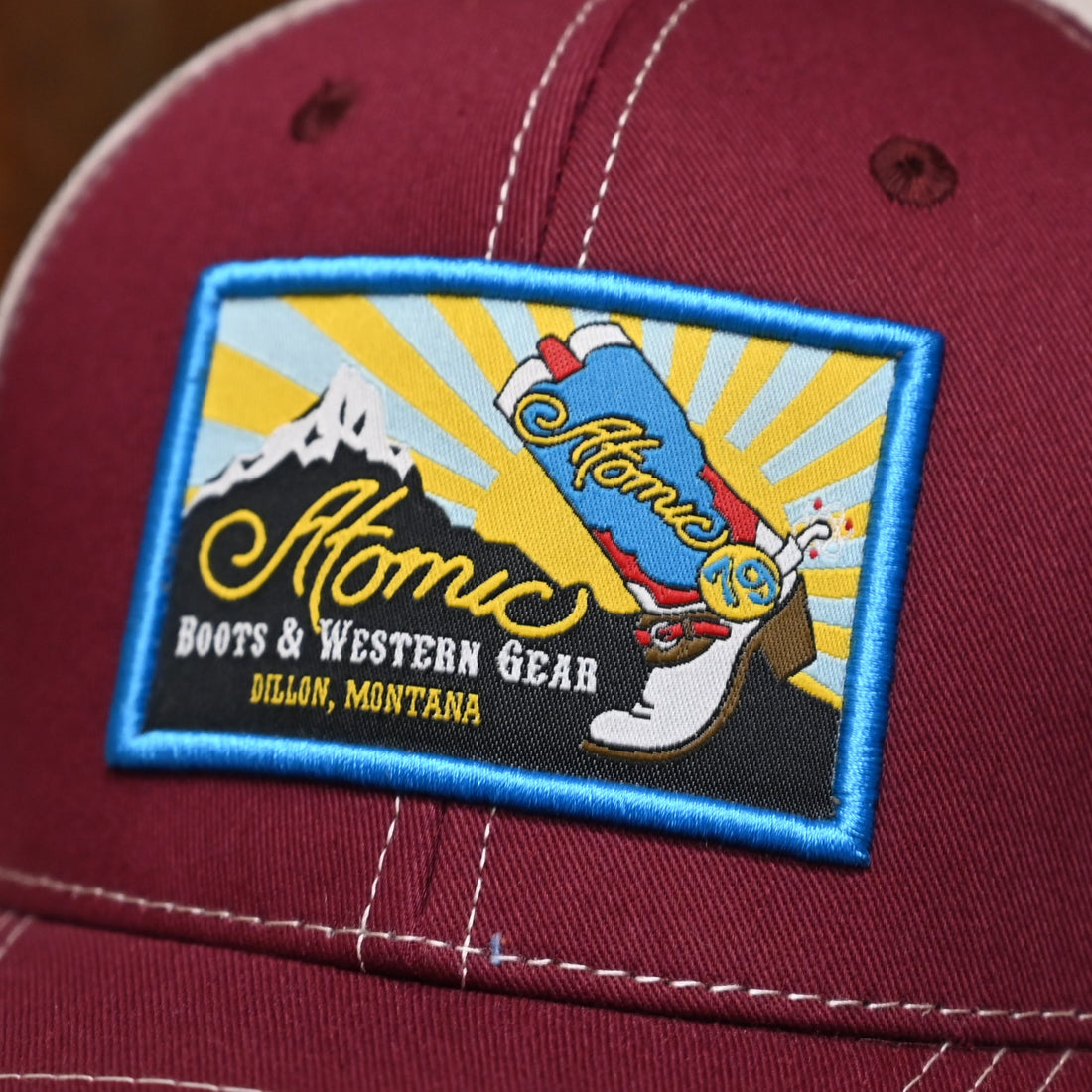Atomic 79Trucker Cap with Sunrise Patch on Maroon view of logo