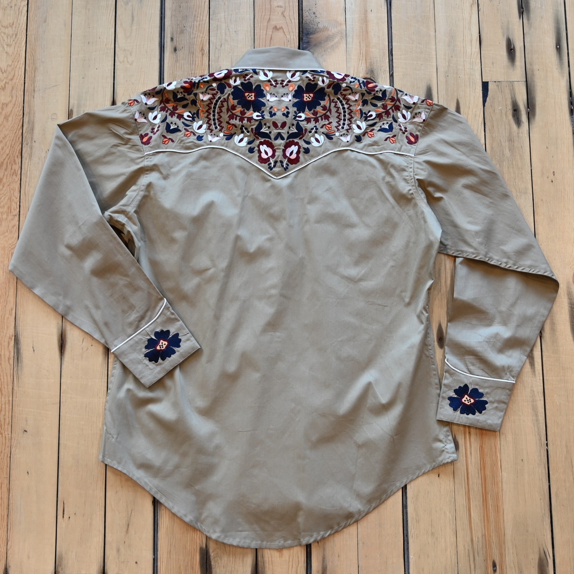 View of Rockmount men’s khaki Western shirt with floral embroidery and classic yoke styling