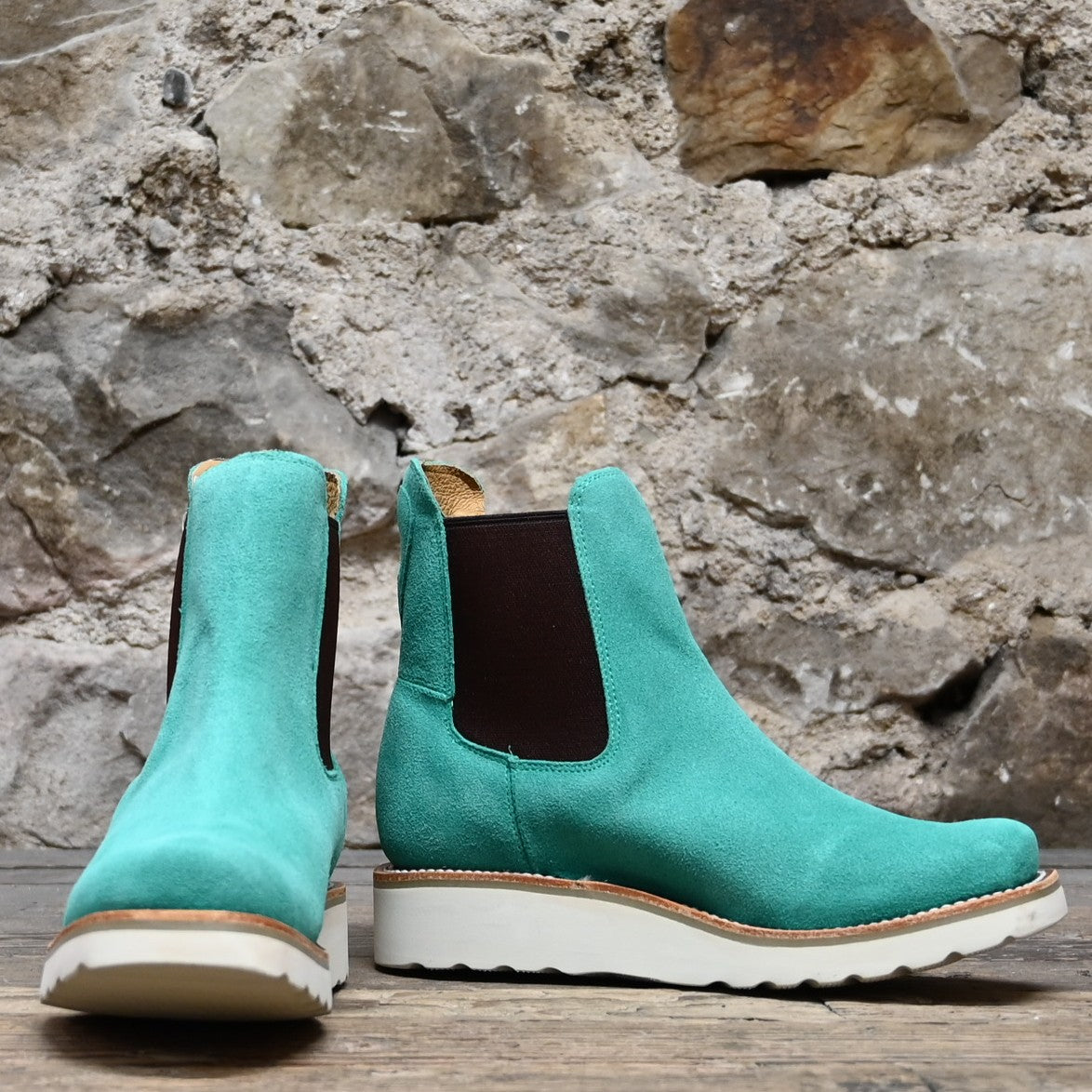 View of Macie Bean ladies turquoise suede wedge bootie with cutter toe and white swedge sole