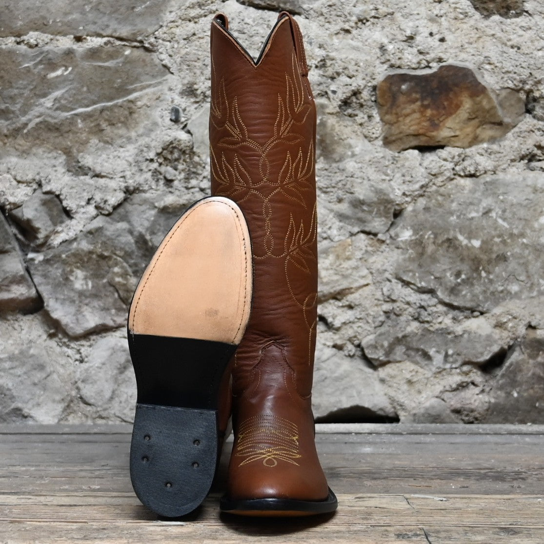 View of Front and Sole of Olathe 17" Tall Leather Polo Style Boots with Brown Mule Vamp and Roper Heel with Yellow Toe Bug Stitching.