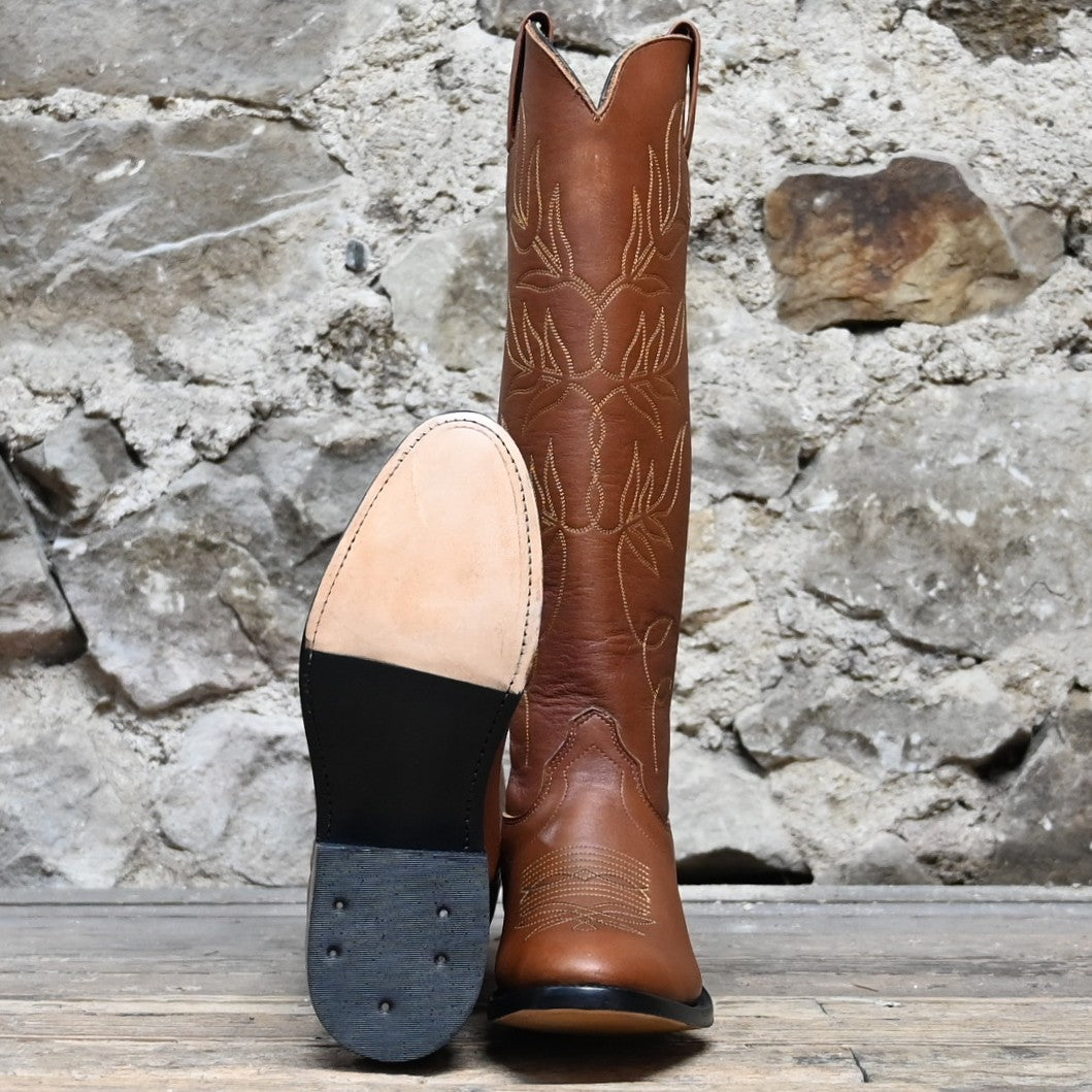View of Front and Sole of Olathe 17" Brown Leather with Black and Yellow Toe Bug.