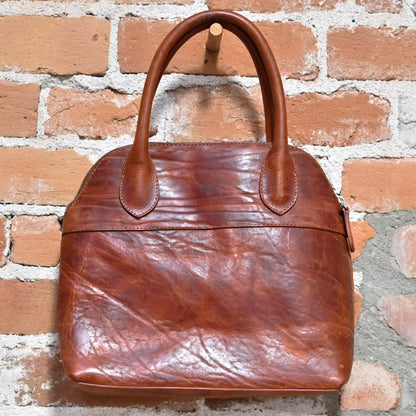 Tuscany in Leather and cotton view of bag hanging