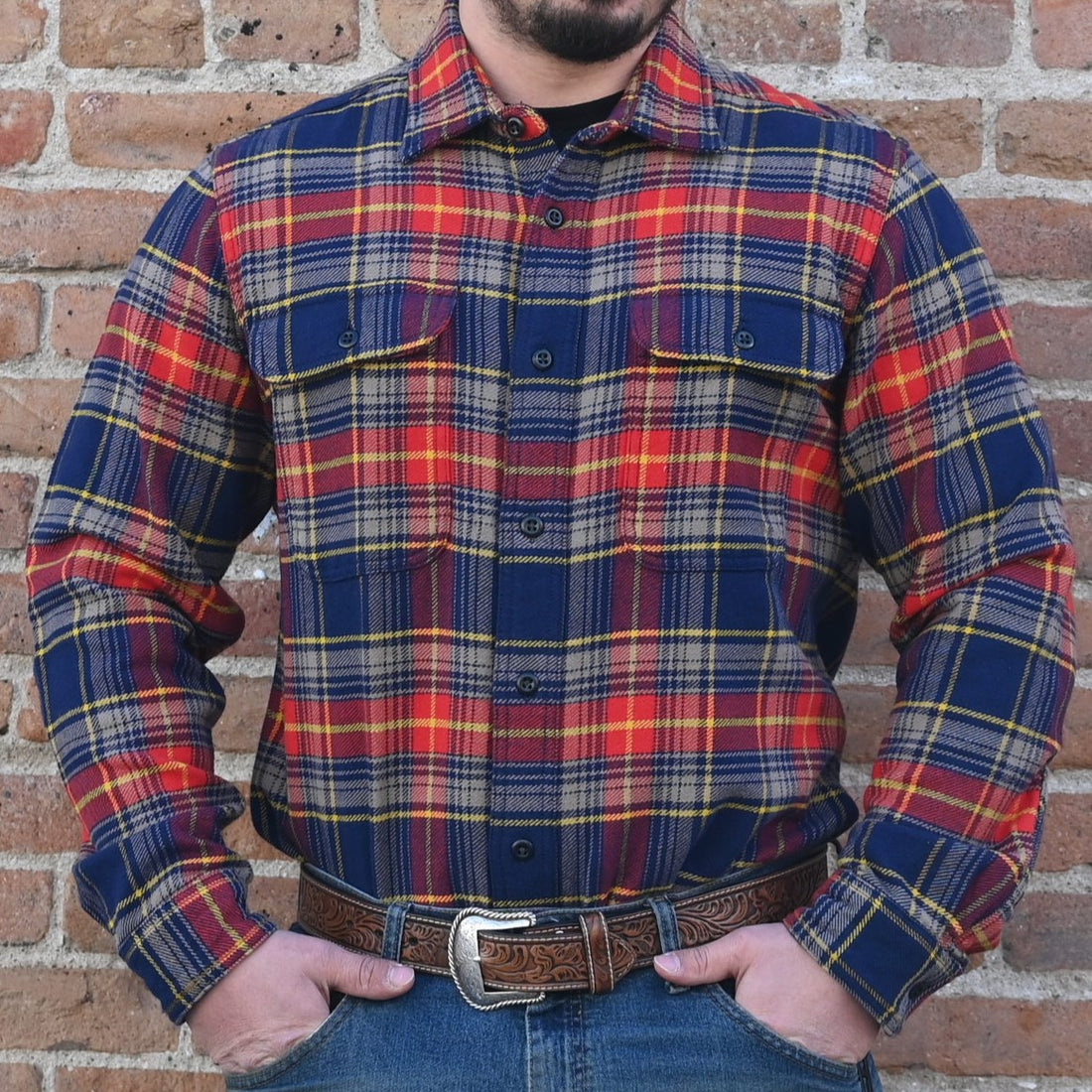 View of Filson Vintage Flannel Work Shirt in assorted colors, showcasing durable cotton twill fabric and pleated back design