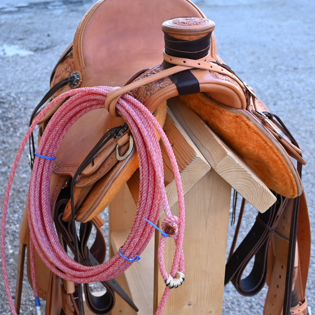 View of Deeter 3B Visalia Roughout Saddle with floral stamping and post horn