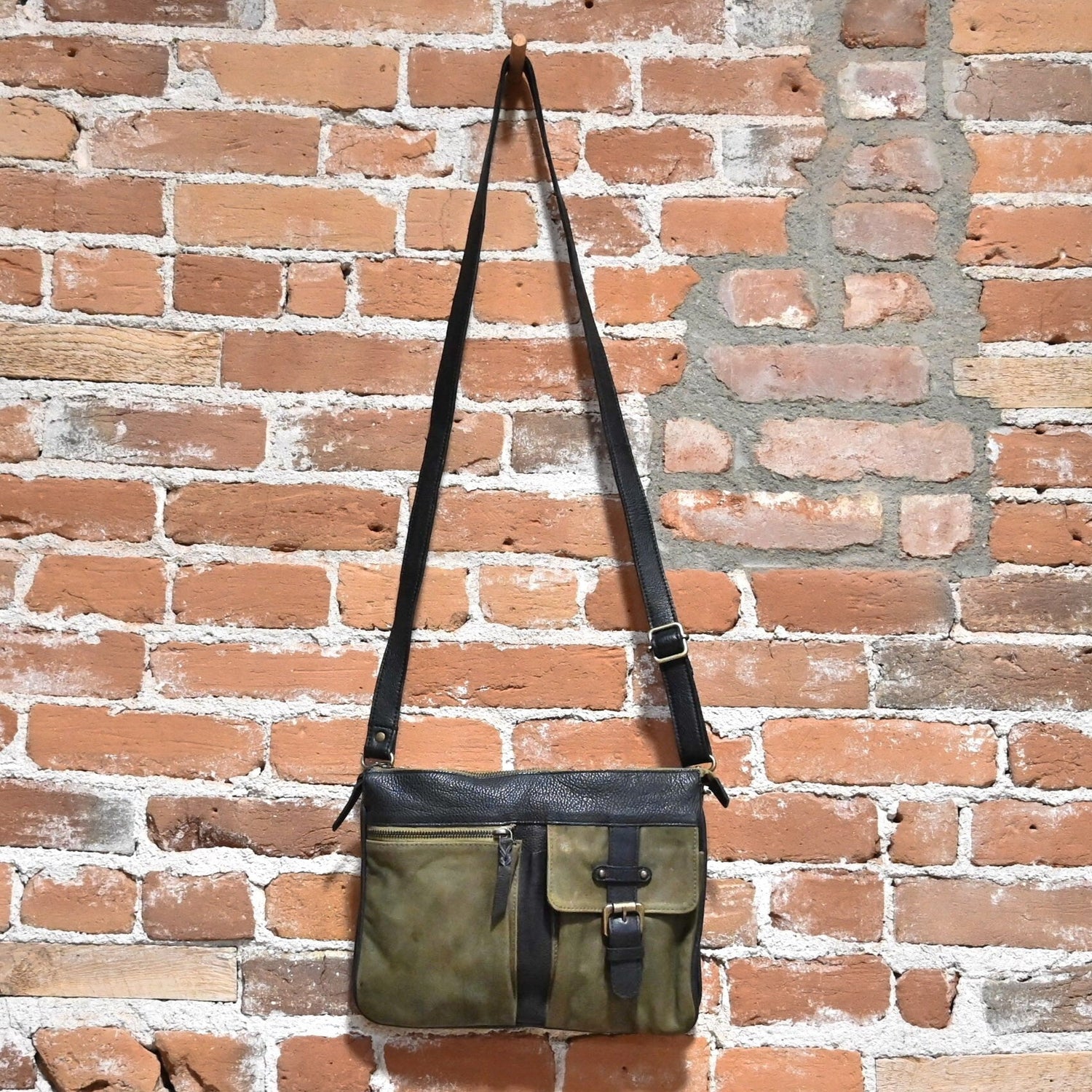 Latico Gypsy Crossbody with multiple outside pockets in Brown and Olive hanging view