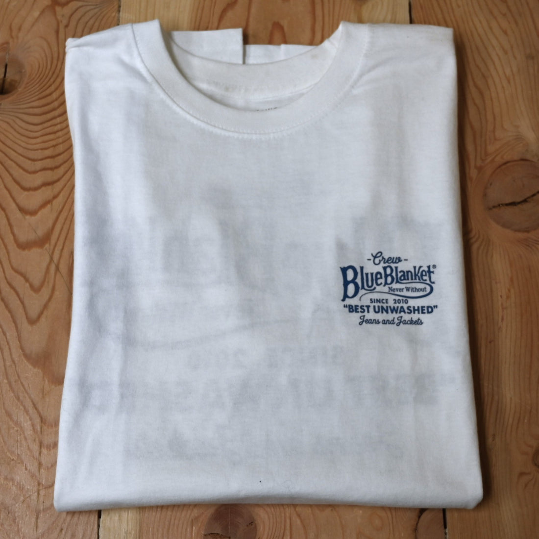 View of Blue Blanket men’s white crew-neck t-shirt with contrasting logo print