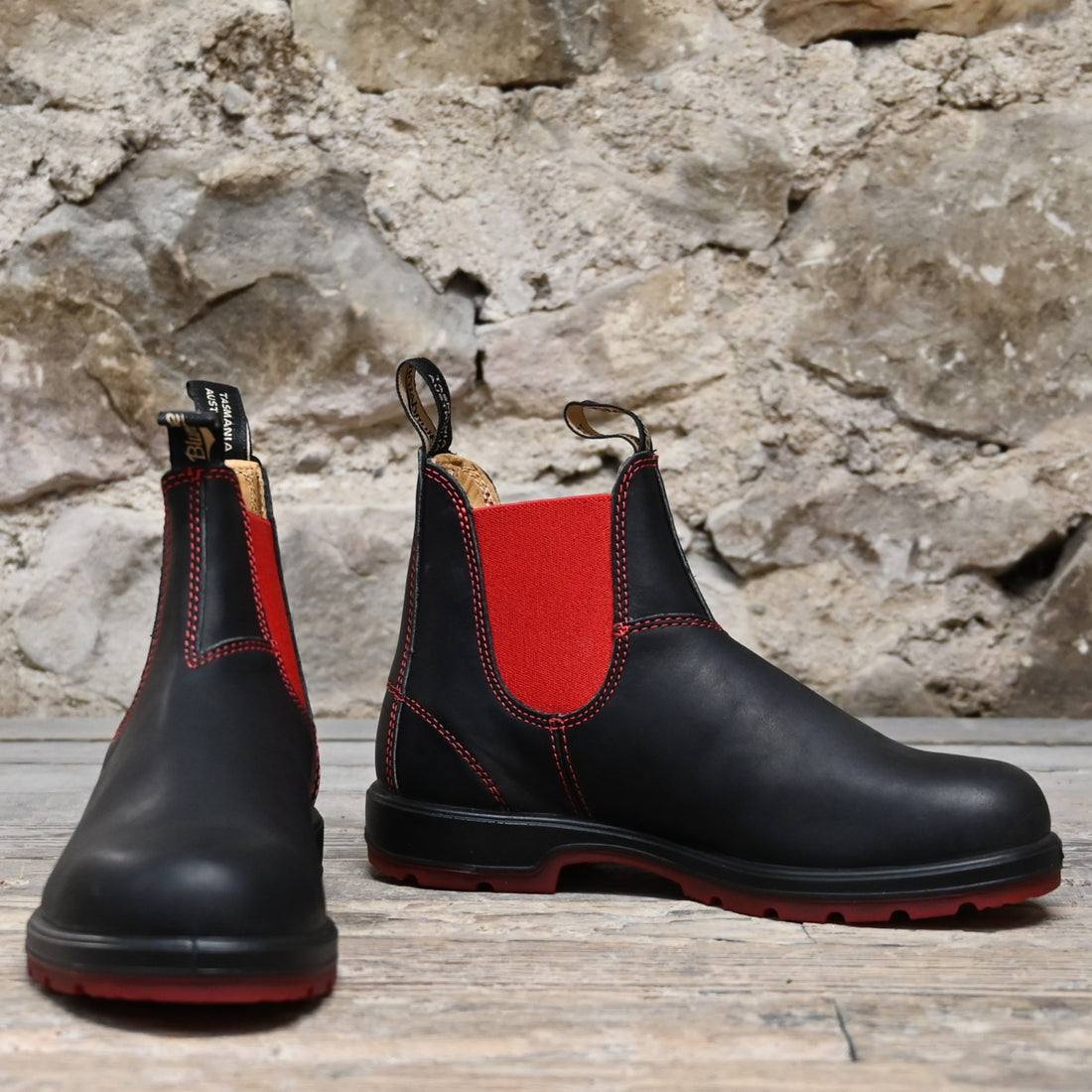 Blundstone Slip On In Black Premium Leather With Red Elastic And Red Outsole view of front and side