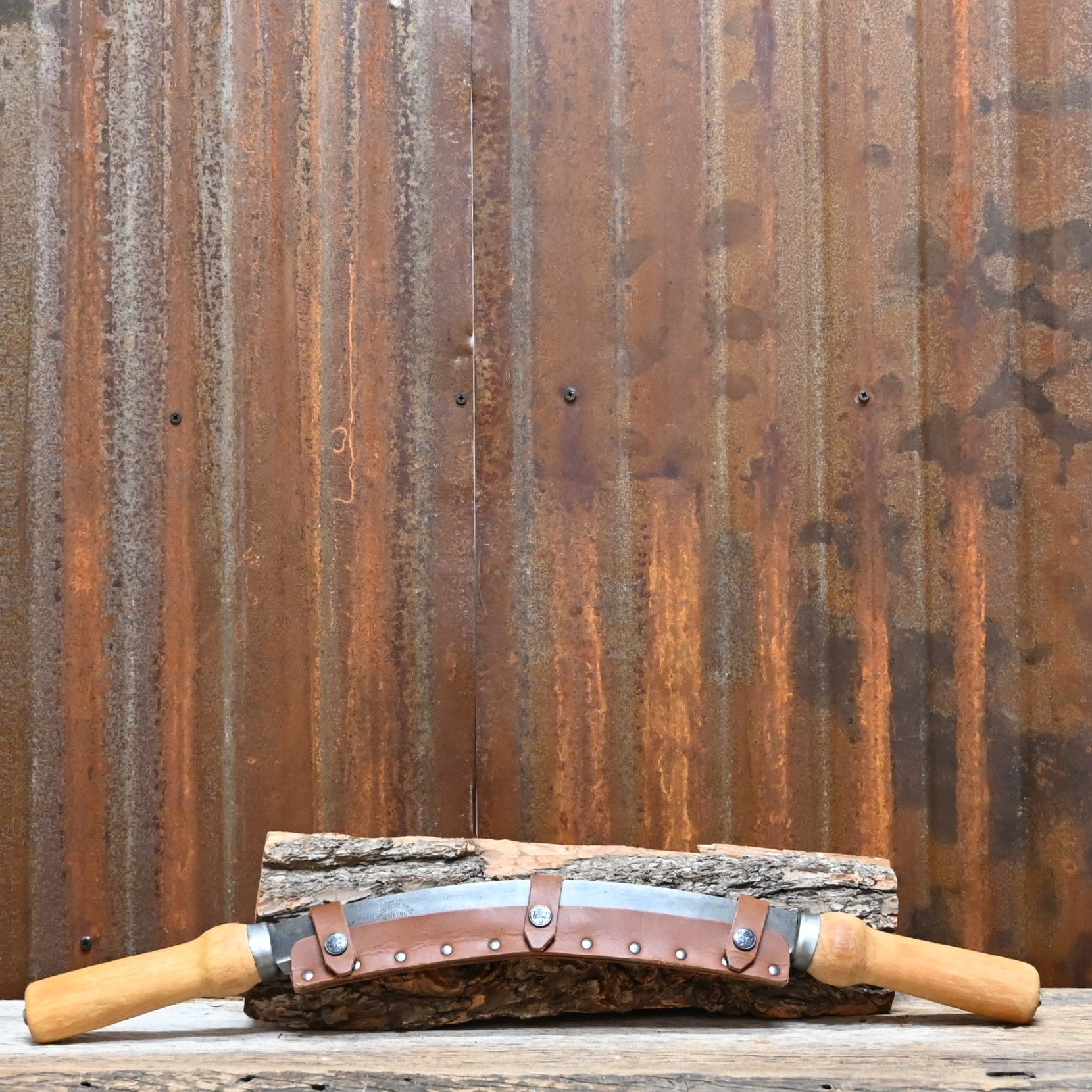 View of drawknife with sheath