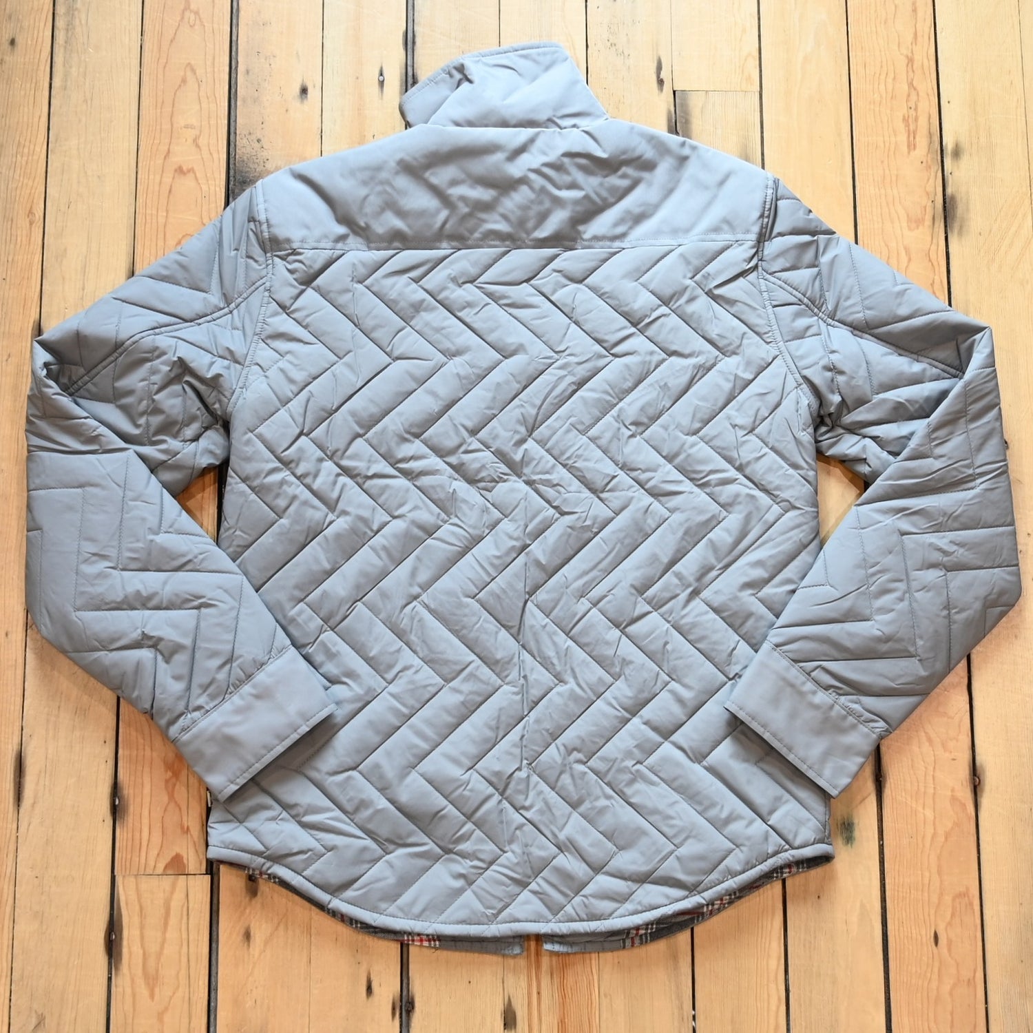 Kimes Ranch men’s Skink quilted jacket with zig-zag pattern, chest flap pockets, and longhorn embroidery