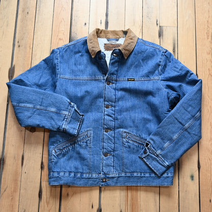 View of Wrangler sherpa-lined denim jacket in Antique Indigo with vintage wash and straight yoke