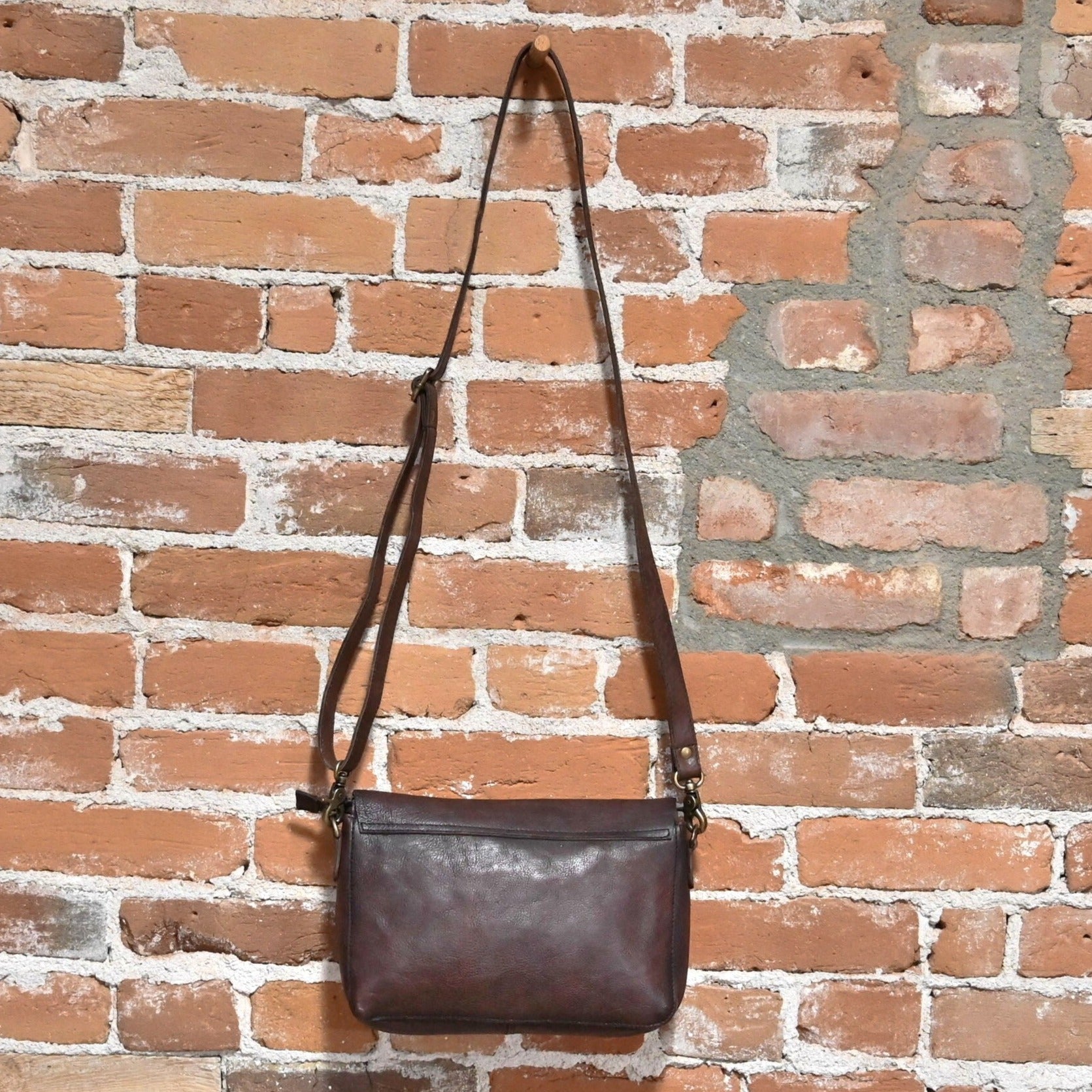 Latico Terra Crossbody with Zipper and Hidden Magnetic Closure in Brown view of back hanging