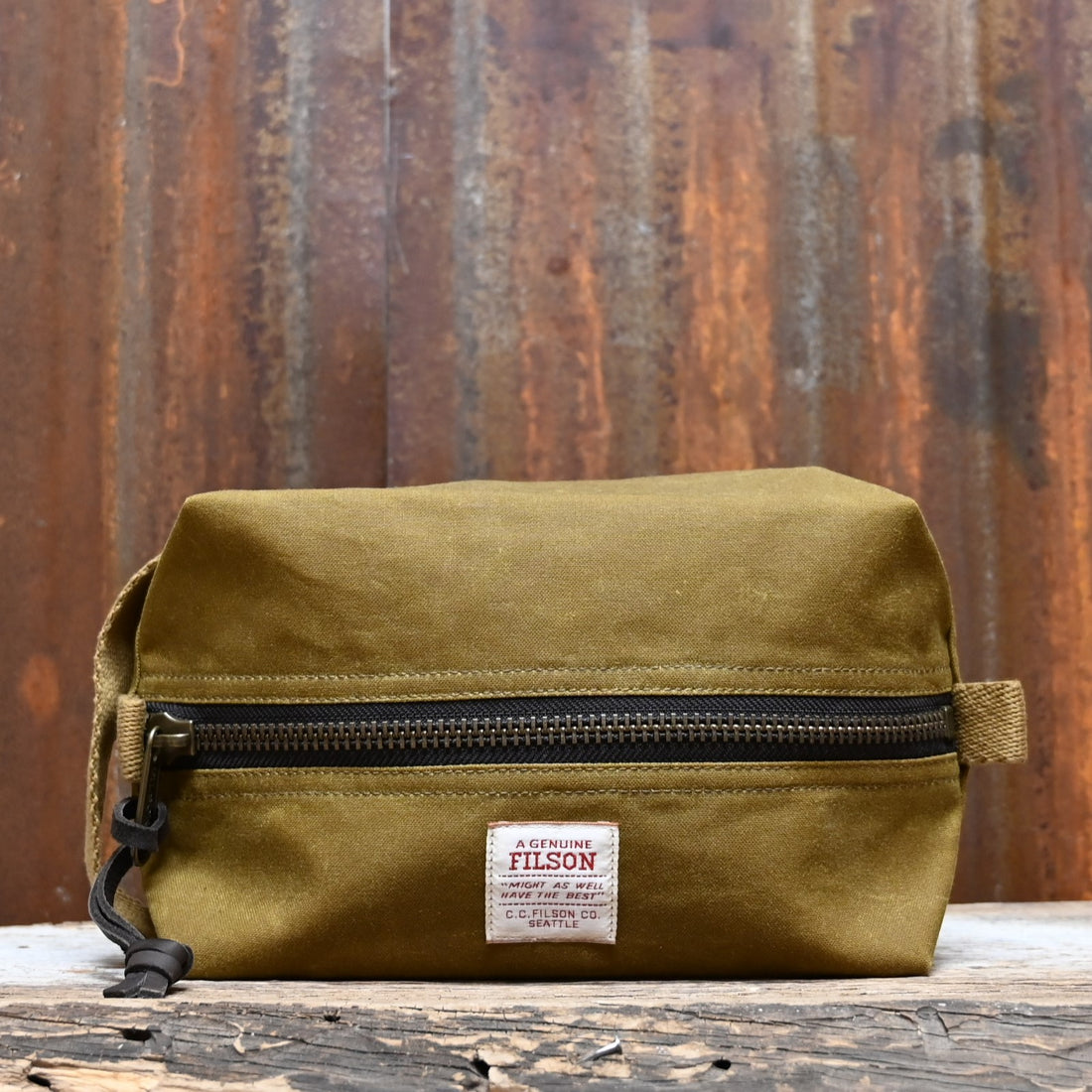 View of Filson Tin Cloth Travel Kit in Dark Tan, showcasing durable waxed cotton exterior and practical design for travel essentials