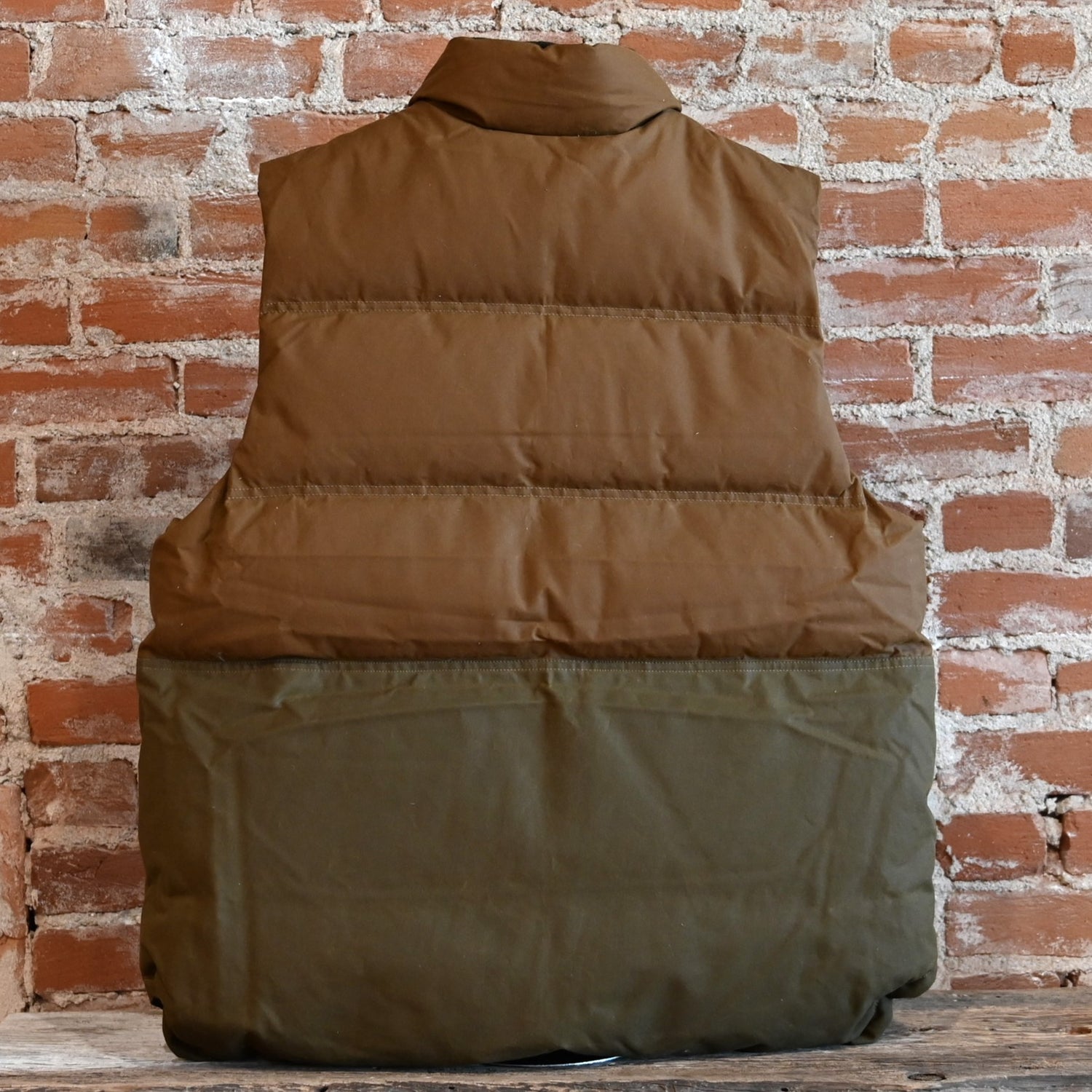 View of back of vest in dark tan