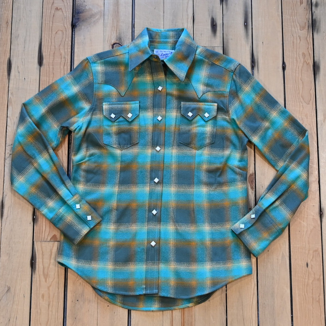 Ladies plush green and turquoise plaid flannel Western shirt with sawtooth pockets and diamond snaps