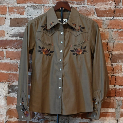 Schaefer Outfitter Ladies Embroidered Snap Shirt in chestnut with floral embroidery, leather-detailed pockets, and snap closures