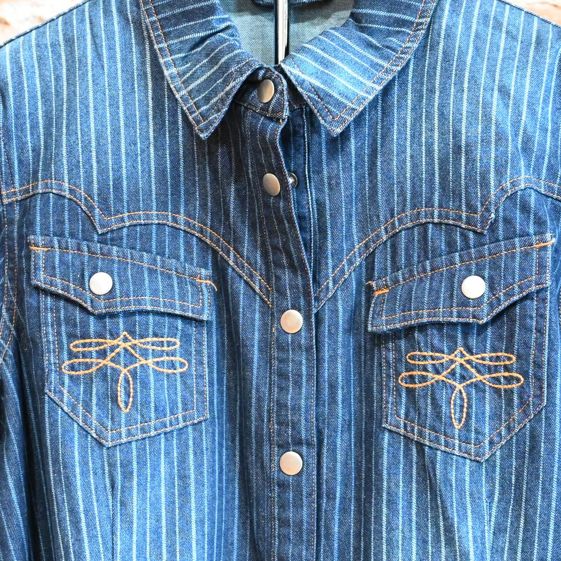 View of Double D Ranch Gunslinger Workshirt – Pinstriped denim shirt with custom concho buttons and detailed embroidery for a Western-inspired design