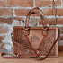 Myra Savanna Ember handtooled concealed carry bag in caramel leather