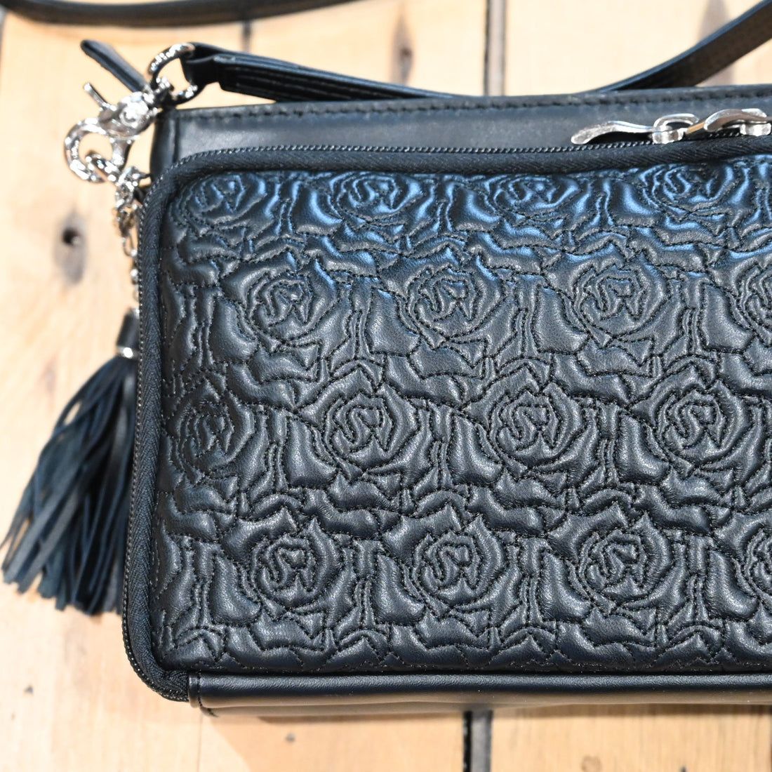 Gun Toten Mamas black embroidered lambskin clutch with rose design and conceal carry features
