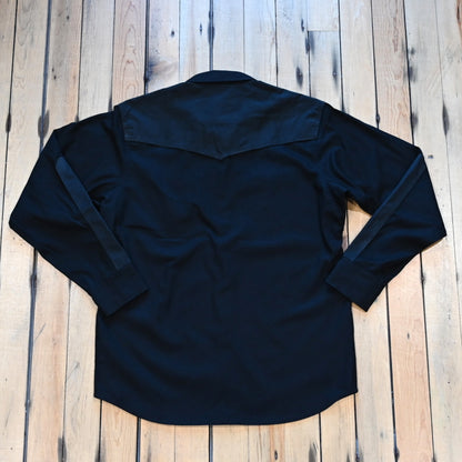Filson × Wrangler Adventure Shirt in black with canvas overlays and snap pockets